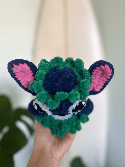 Close-up of Stitch crochet plushie with large floppy ears, handmade Lilo & Stitch amigurumi toy
