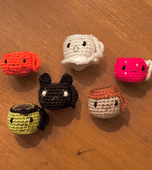 Six autumn and Halloween emoji coffee cup keychains featuring Fly Agaric, Ghost, Pumpkin, Frankenstein, Black Cat and Acorn designs