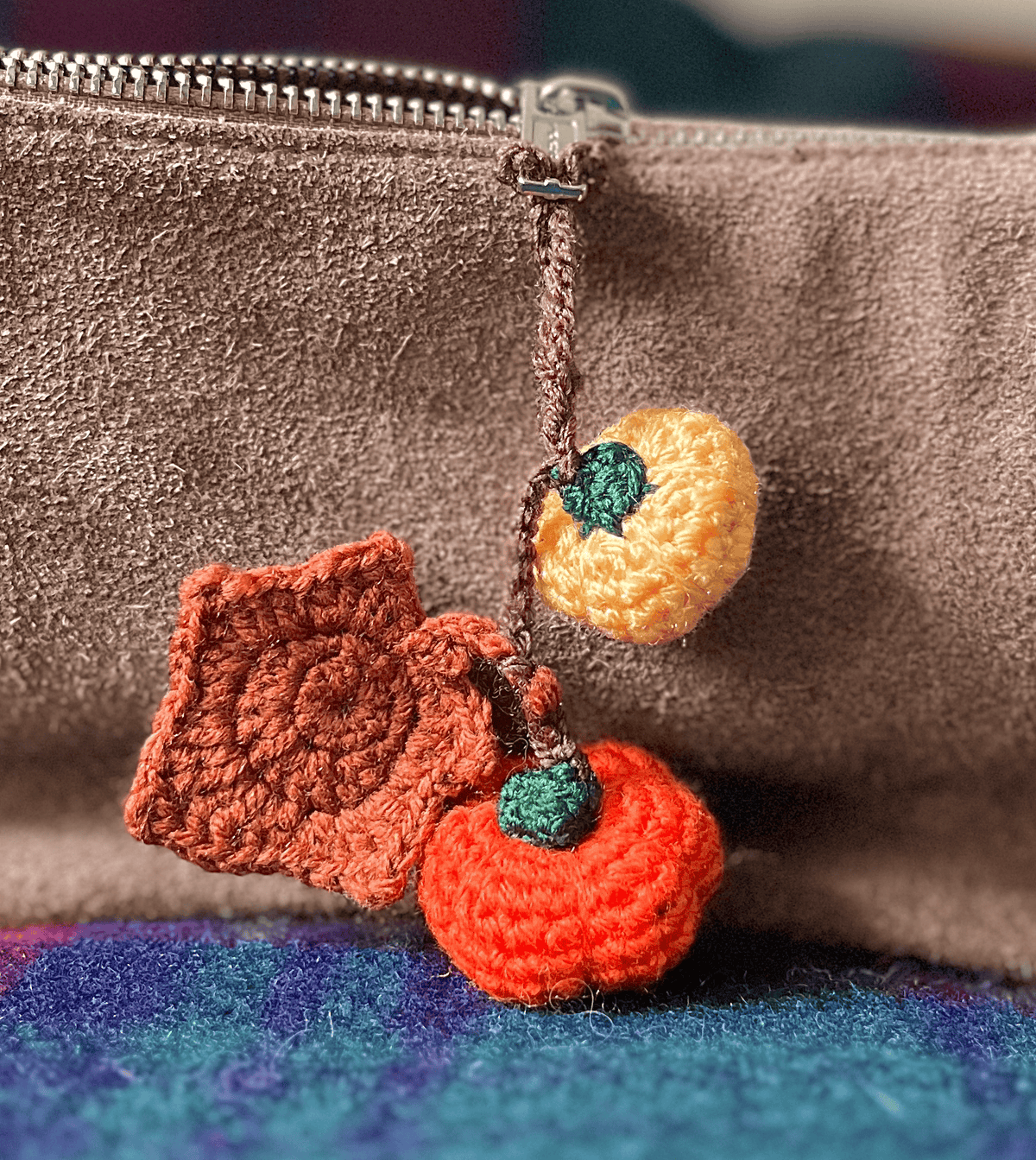Crochet pumpkin and maple leaf keychain, handmade autumn accessory and seasonal fall bag charm