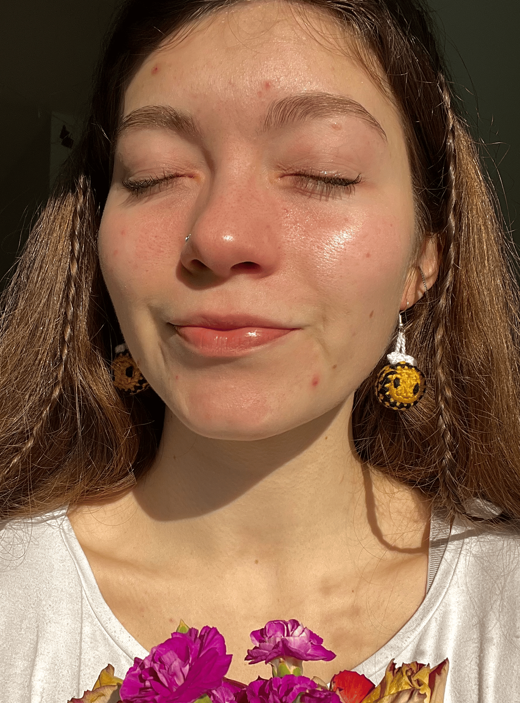 Handmade bumblebee crochet earrings worn as spring jewellery, cute nature-inspired accessories and cottagecore fashion