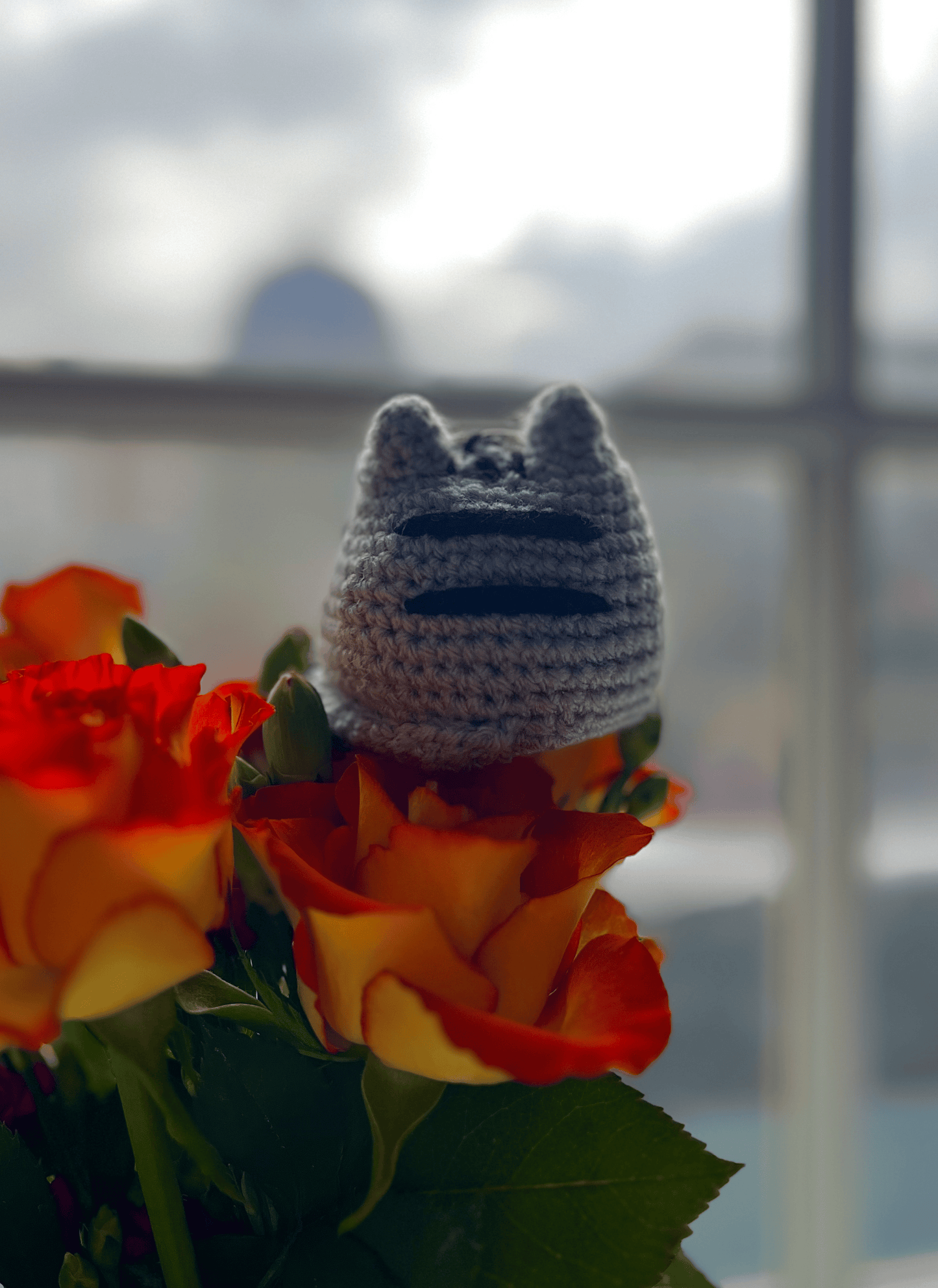 Handmade Pusheen crochet keyring attached to a bag, cute cat accessory and kawaii Pusheen bag charm