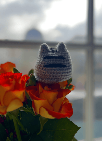 Handmade Pusheen crochet keyring attached to a bag, cute cat accessory and kawaii Pusheen bag charm