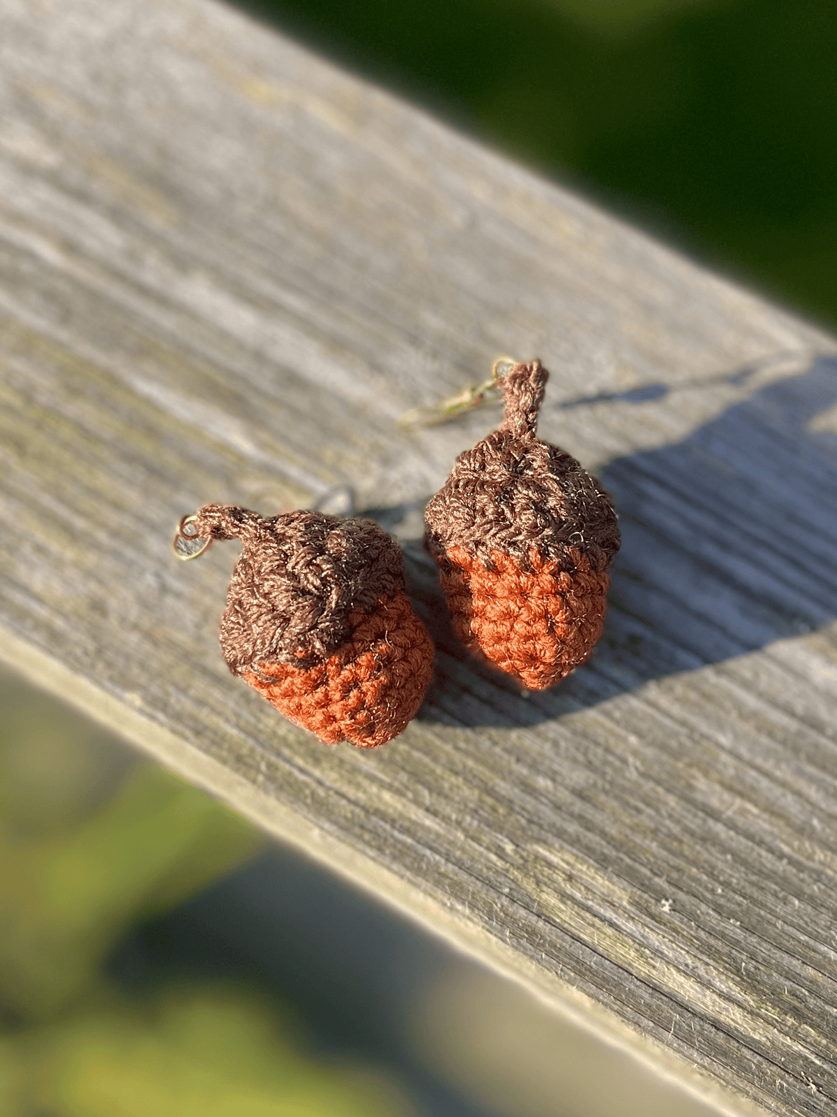 Handmade crochet acorn earrings in warm earthy colours, autumn nature jewellery