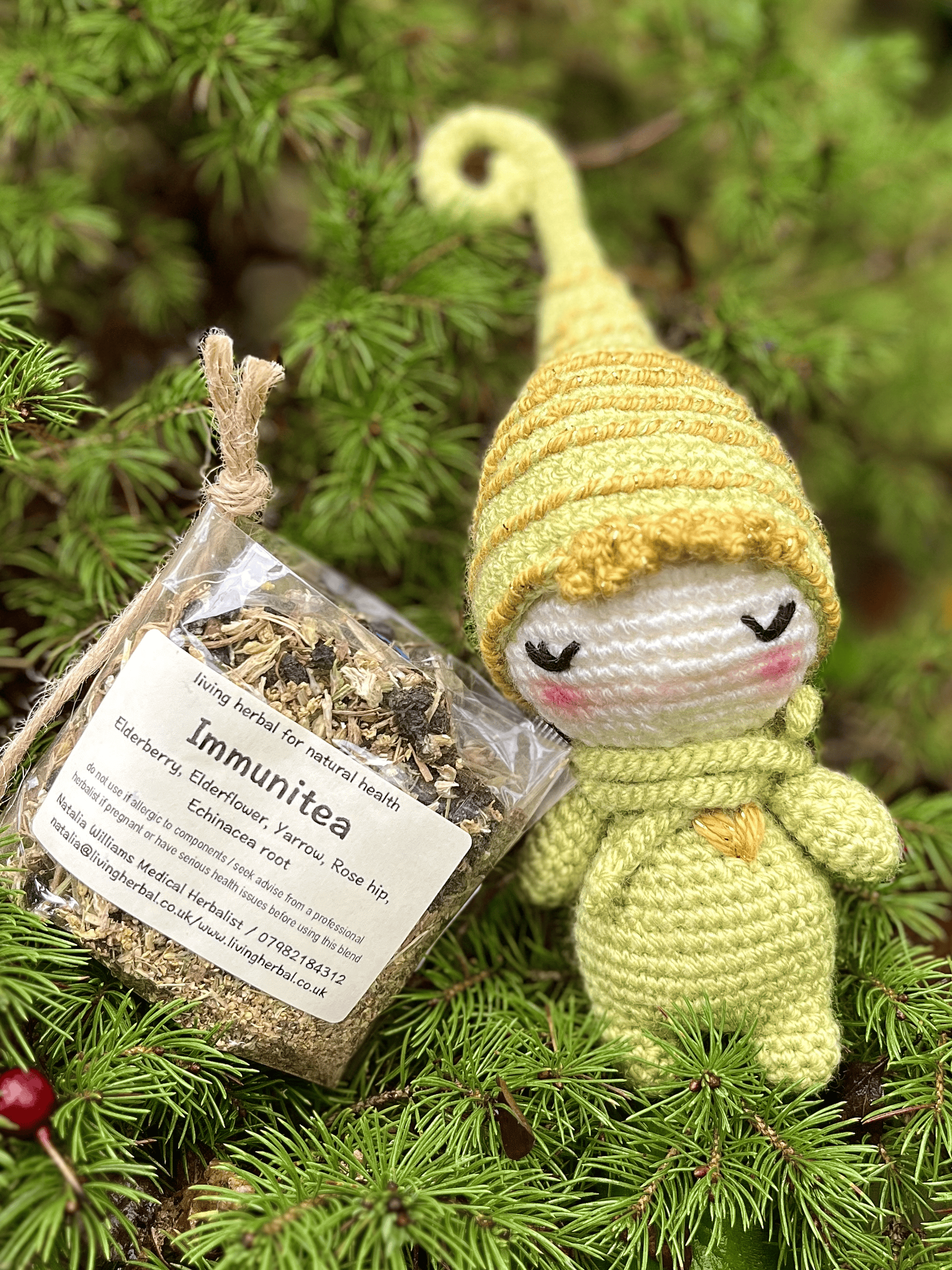 Crochet Christmas elf companion paired with Immunitea herbal tea winter gift set