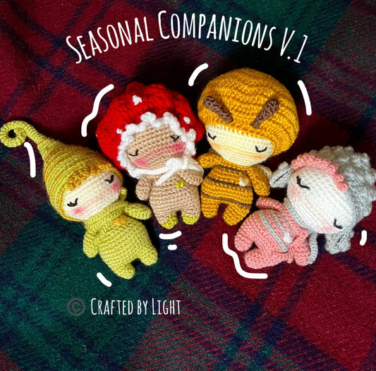 Four seasonal crochet companions displayed as handmade home decor featuring lamb, bumblebee, fly agaric mushroom and Christmas elf
