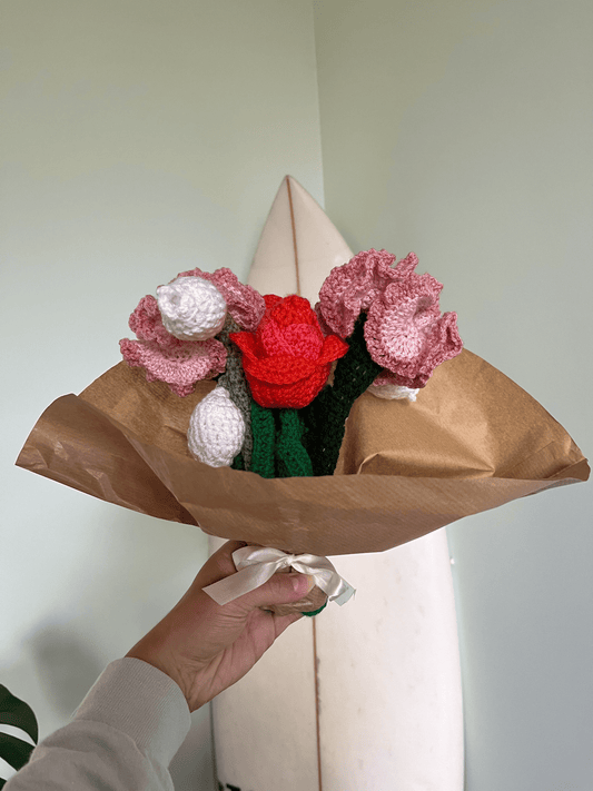 Handmade crochet spring flower bouquet with carnations, tulips and lily of the valley for floral home decor