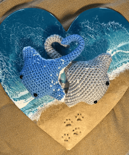 Crochet manta ray keychain pair featuring Bluespotted Ribbontail Ray and Reef Manta Ray, handmade ocean accessories