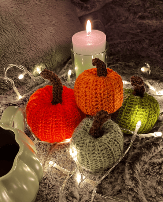 Handmade crochet pumpkin assortment for autumn and Halloween home decor, seasonal pumpkin decorations in warm colours