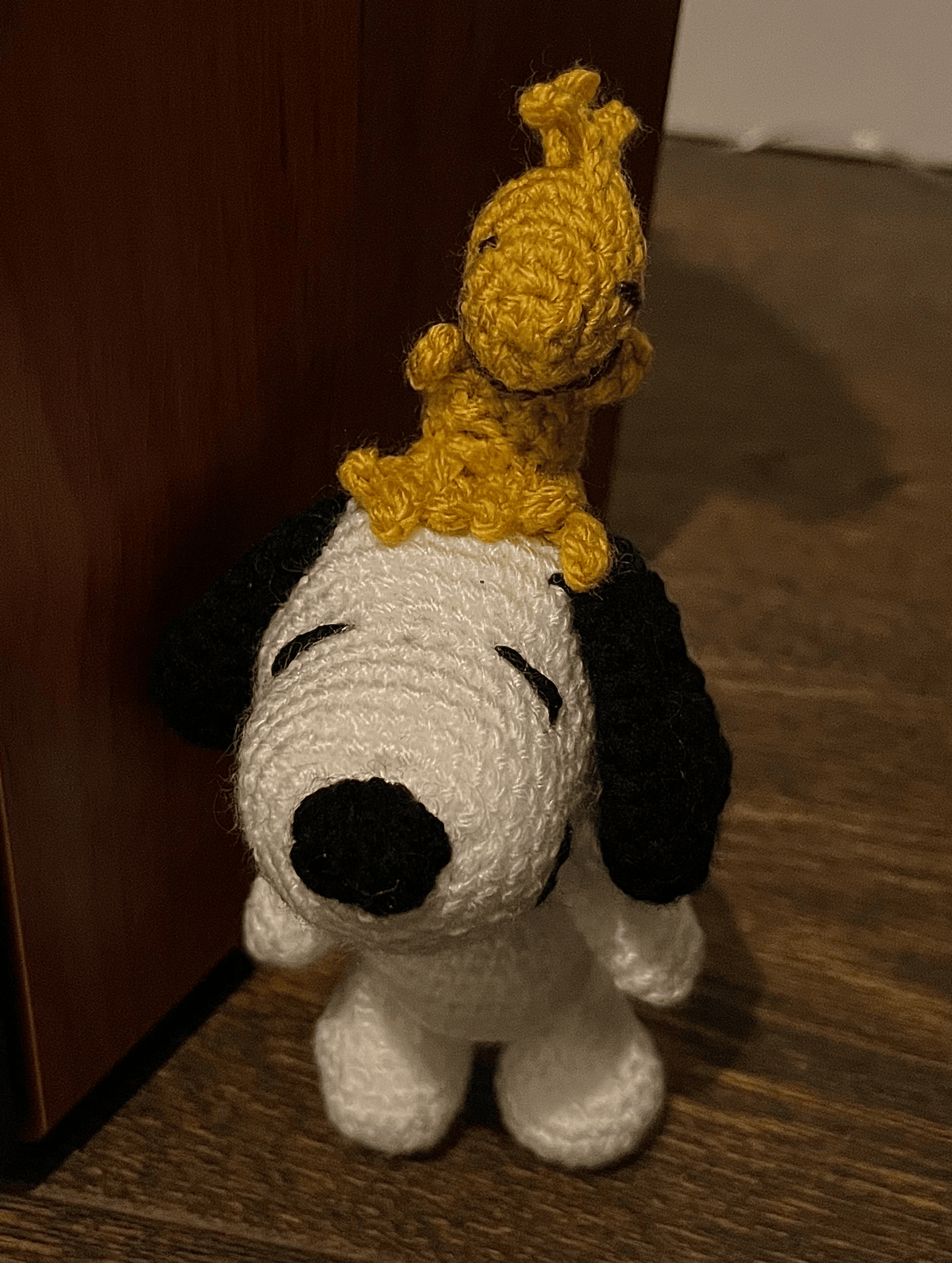 Crochet Snoopy and Woodstock keychain featuring the iconic Peanuts duo, handmade character accessory and collectible