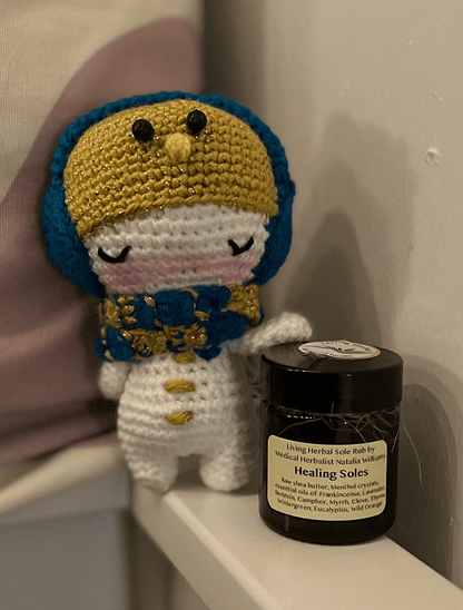 Crochet snowman companion paired with Healing Soles herbal foot balm winter gift set