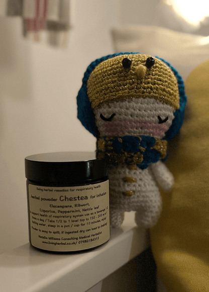 Olaf crochet snowman paired with Chestea herbal powder as a cosy winter gift set