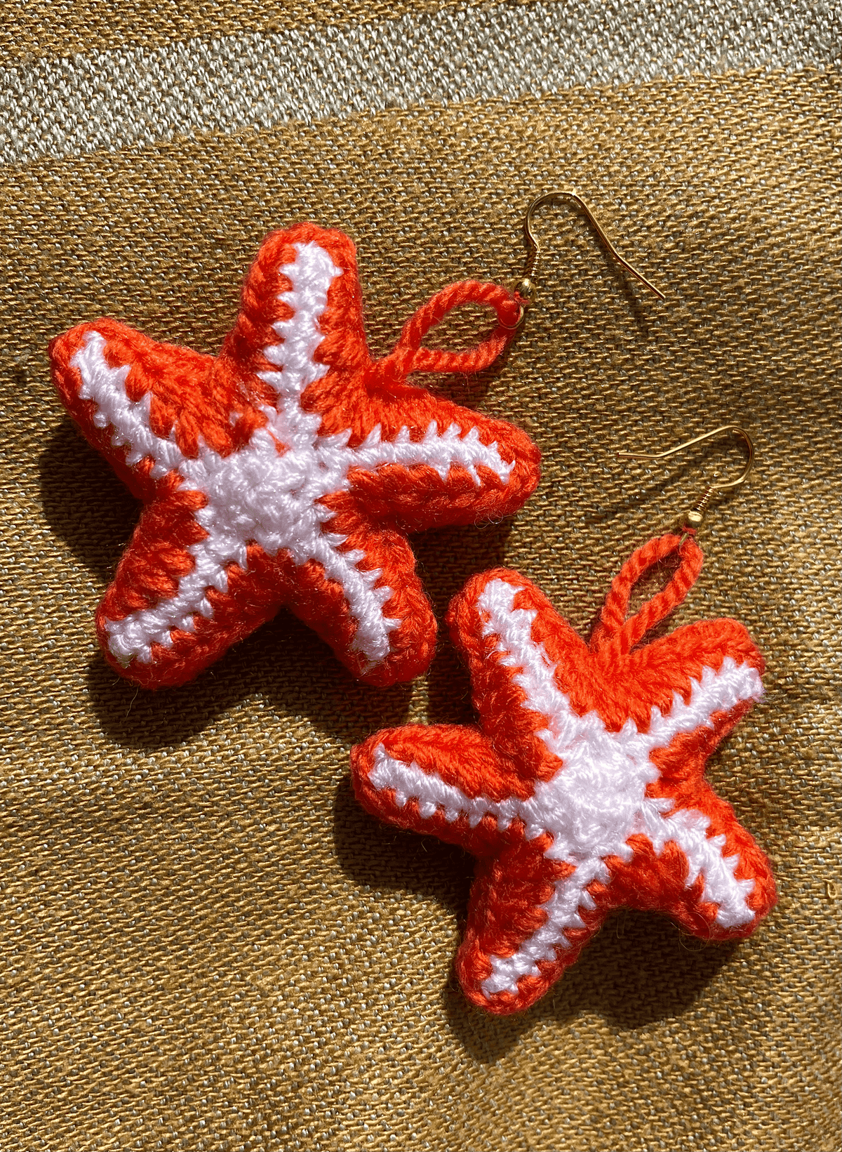 Crochet starfish earrings in gold and silver, handmade ocean-inspired jewellery and summer sea-themed accessories