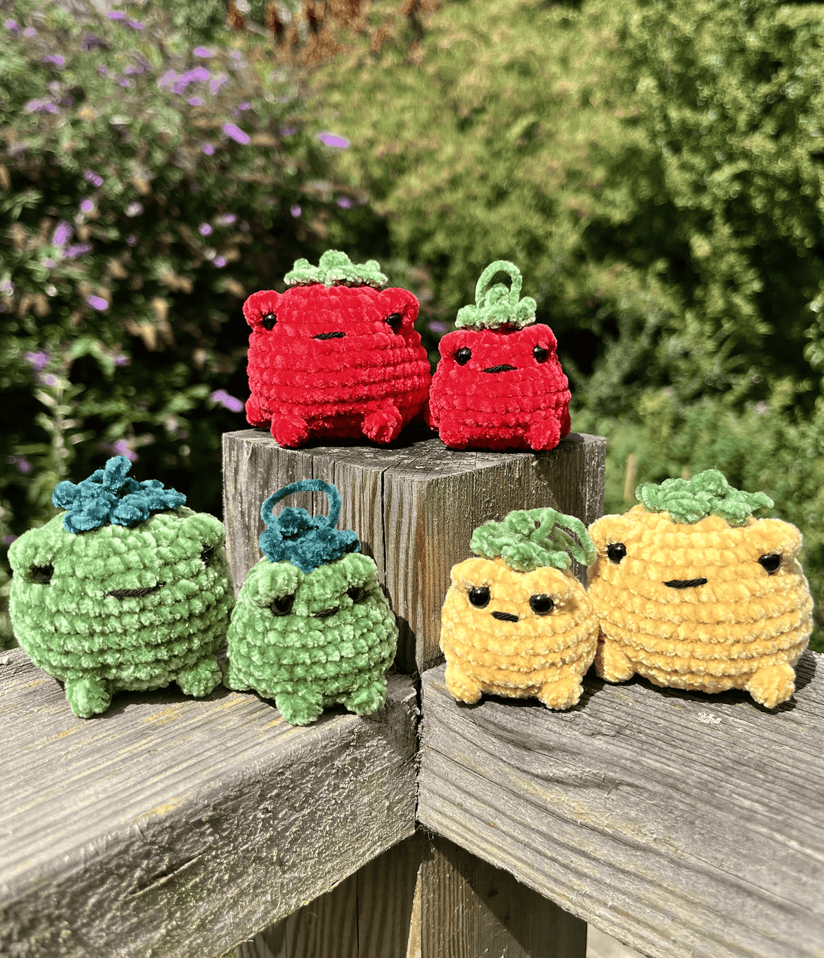 Six handmade TOADmato crochet toad plushies and mini keyrings in red, yellow and green chenille yarn