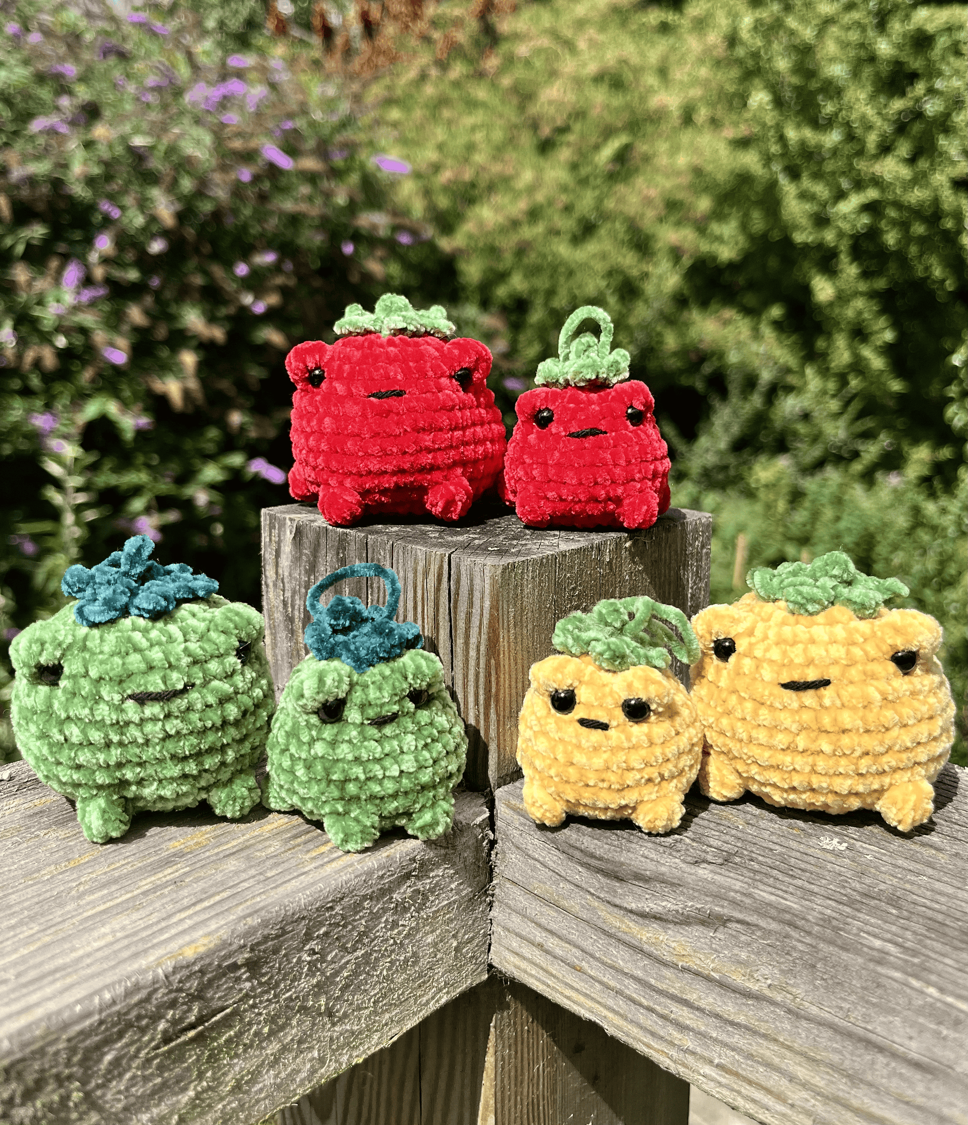 Six handmade TOADmato crochet toad plushies and mini keyrings in red, yellow and green chenille yarn