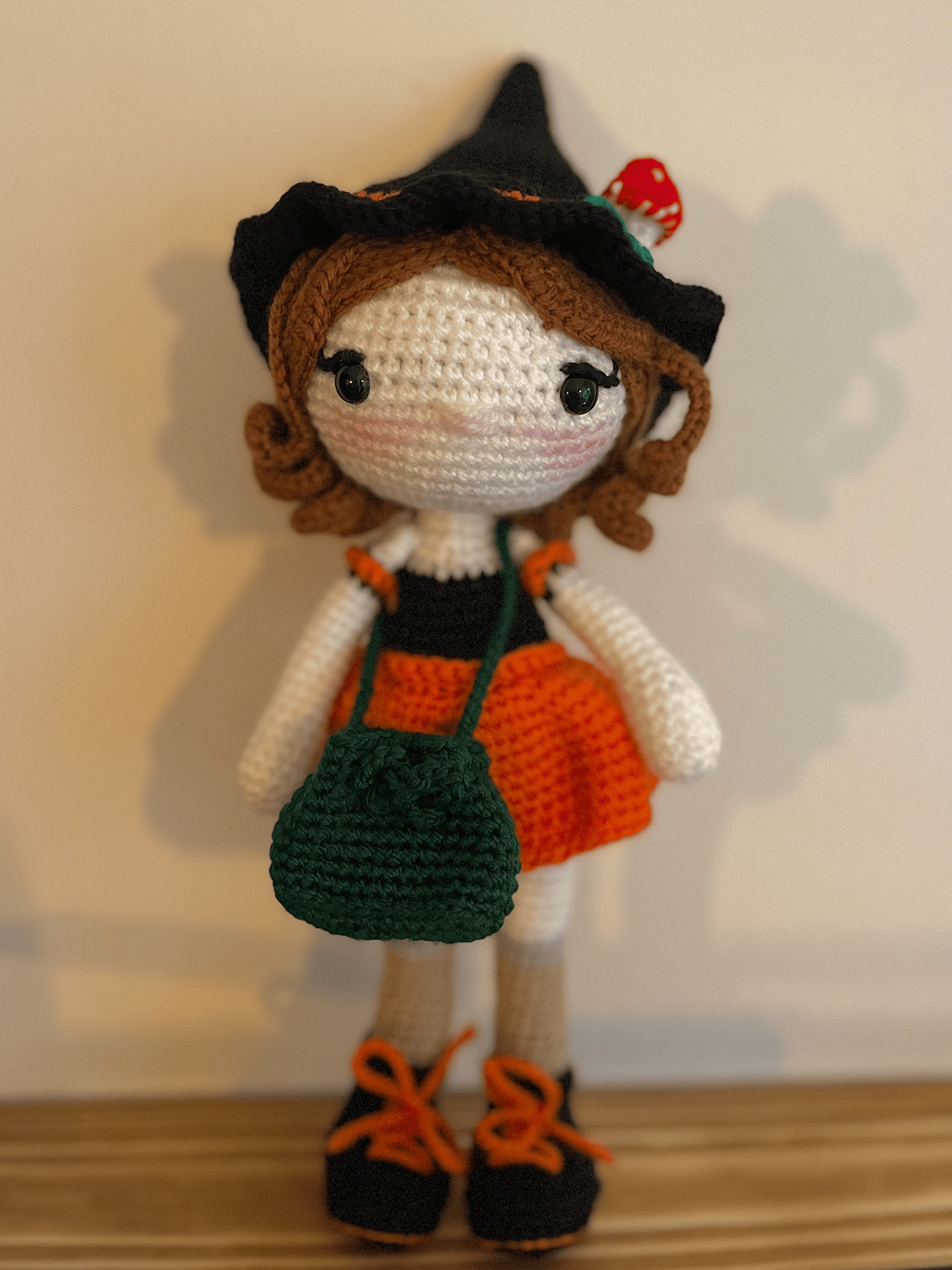 Heather the Foraging Witch crochet plush with mushroom hat and foraging pouch