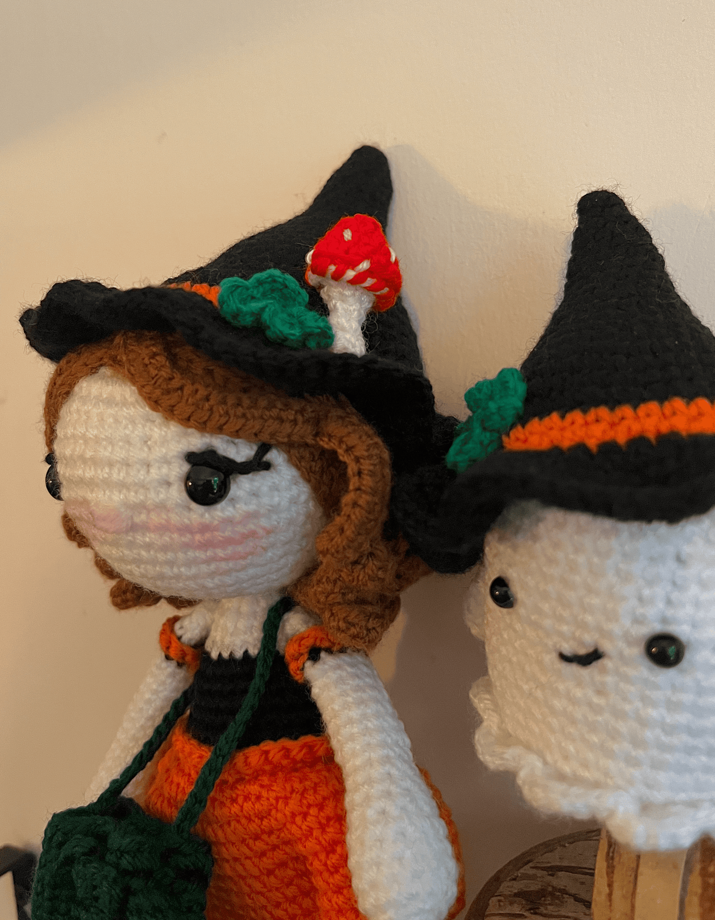 Handmade crochet witch and ghost companions displayed on a shelf as cottagecore and autumn decor