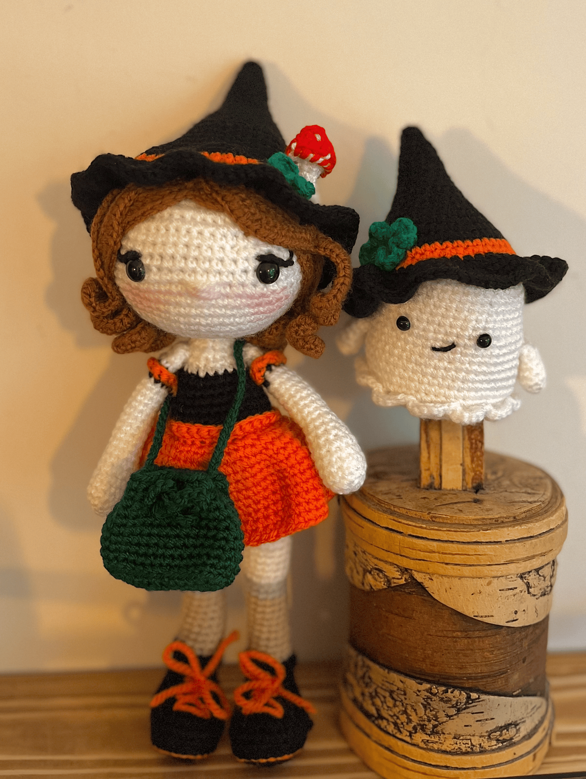 Crochet witch and ghost displayed as autumn cottagecore home decor with woodland styling