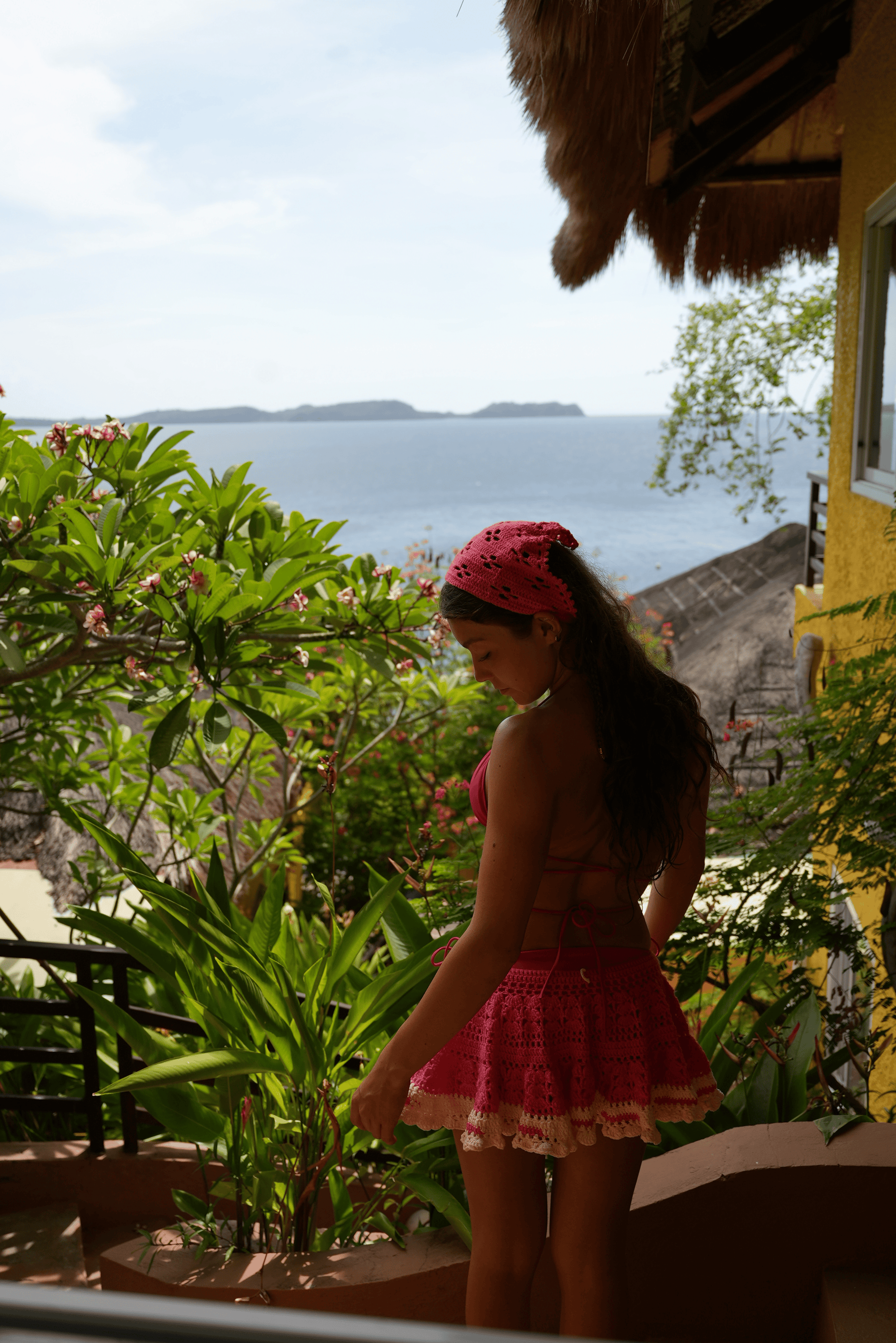 Crochet summer beach skirt styled over swimwear, handmade crochet beachwear and holiday outfit
