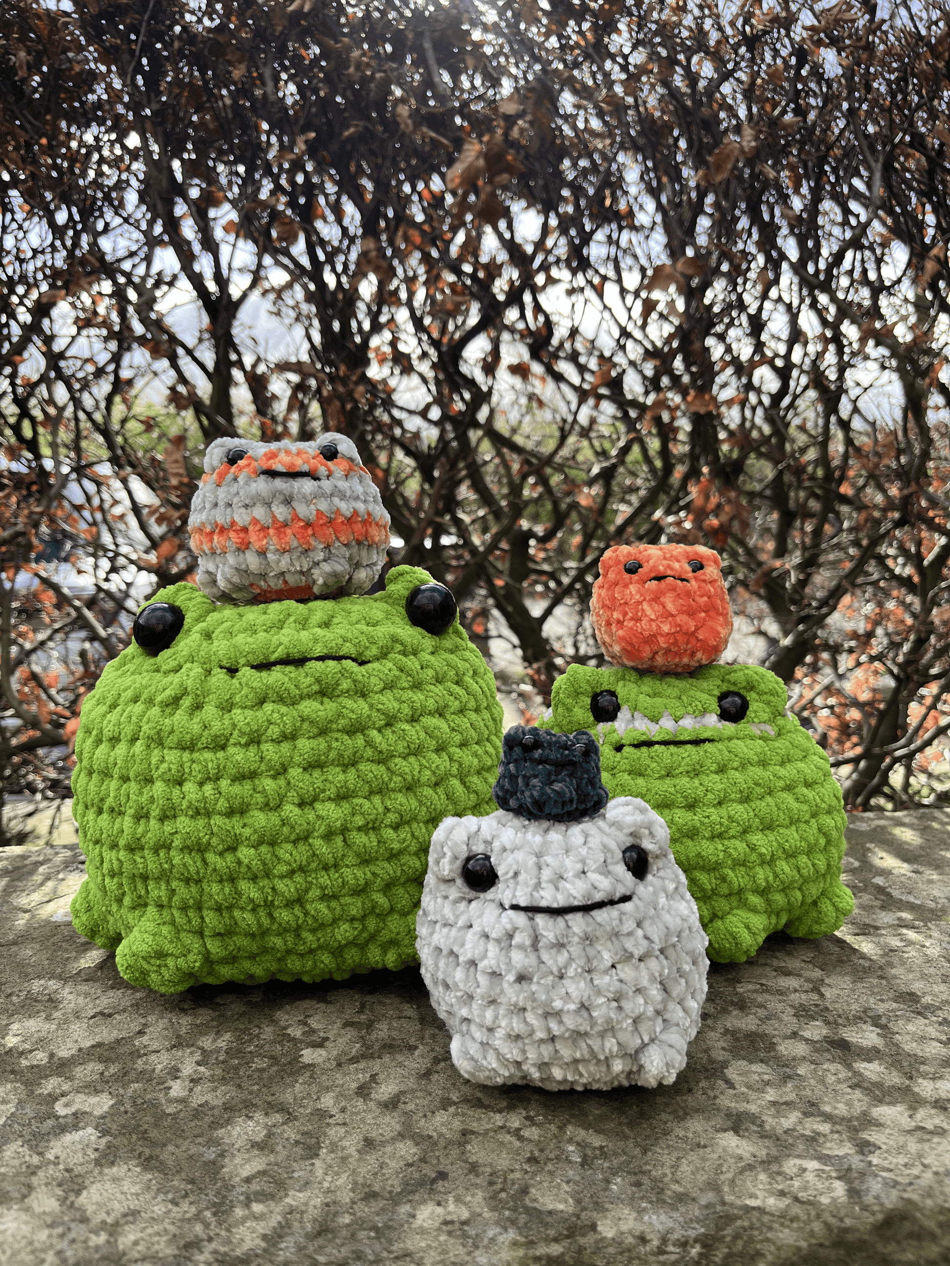 Six handmade crochet frog plushies in Mega, Big, Medium and Mini sizes by Crafted by Light