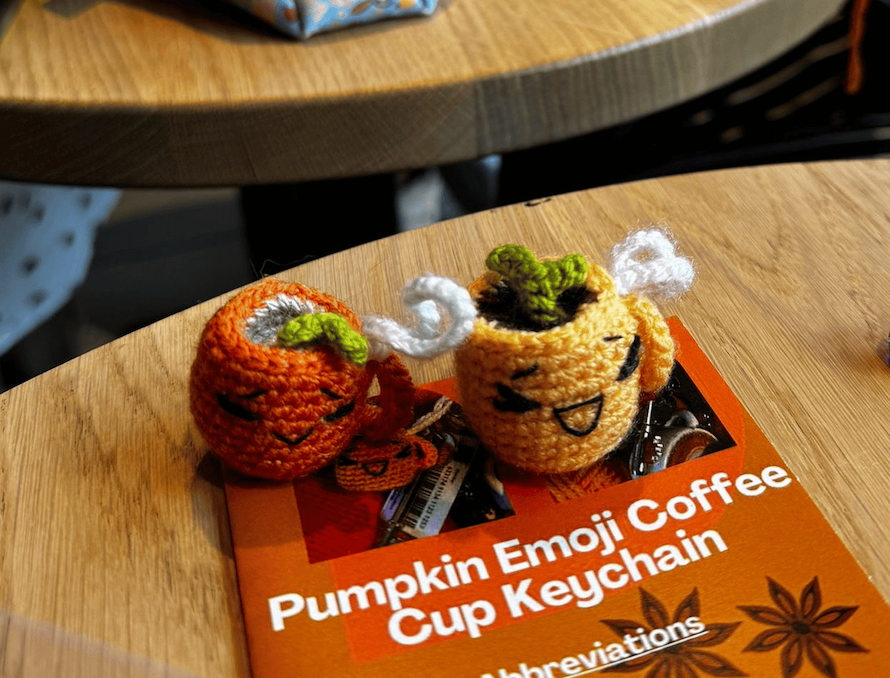 Handmade crochet emoji pumpkin coffee cup keychain, cute Halloween accessory, autumn coffee bag charm and pumpkin keyring