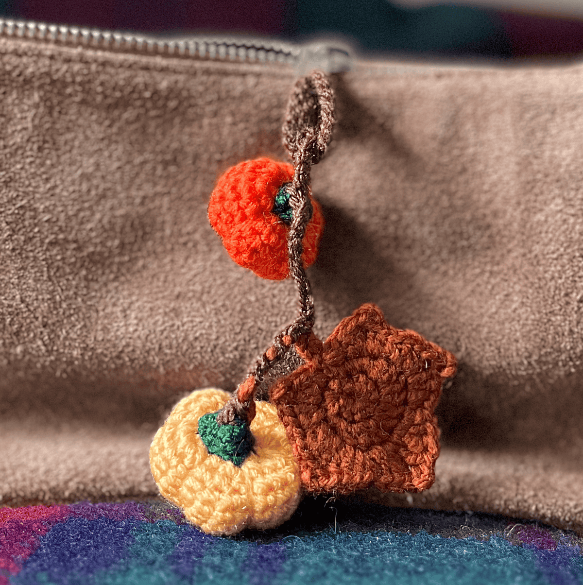 Crochet pumpkin and maple leaf keychain, handmade autumn accessory and seasonal fall bag charm
