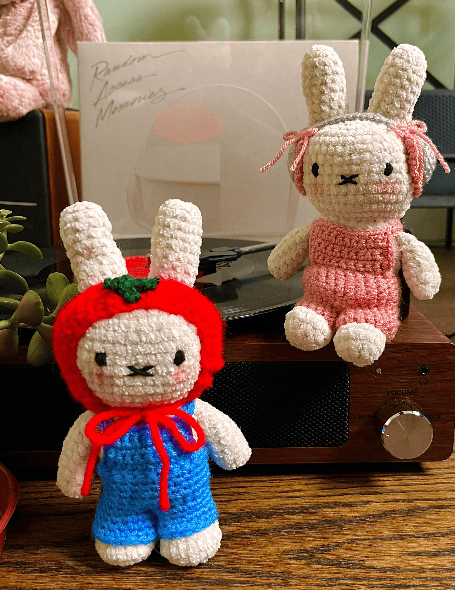 Two handmade Miffy crochet plush toys in blue and pink outfits, cute Miffy character collectibles and home decor