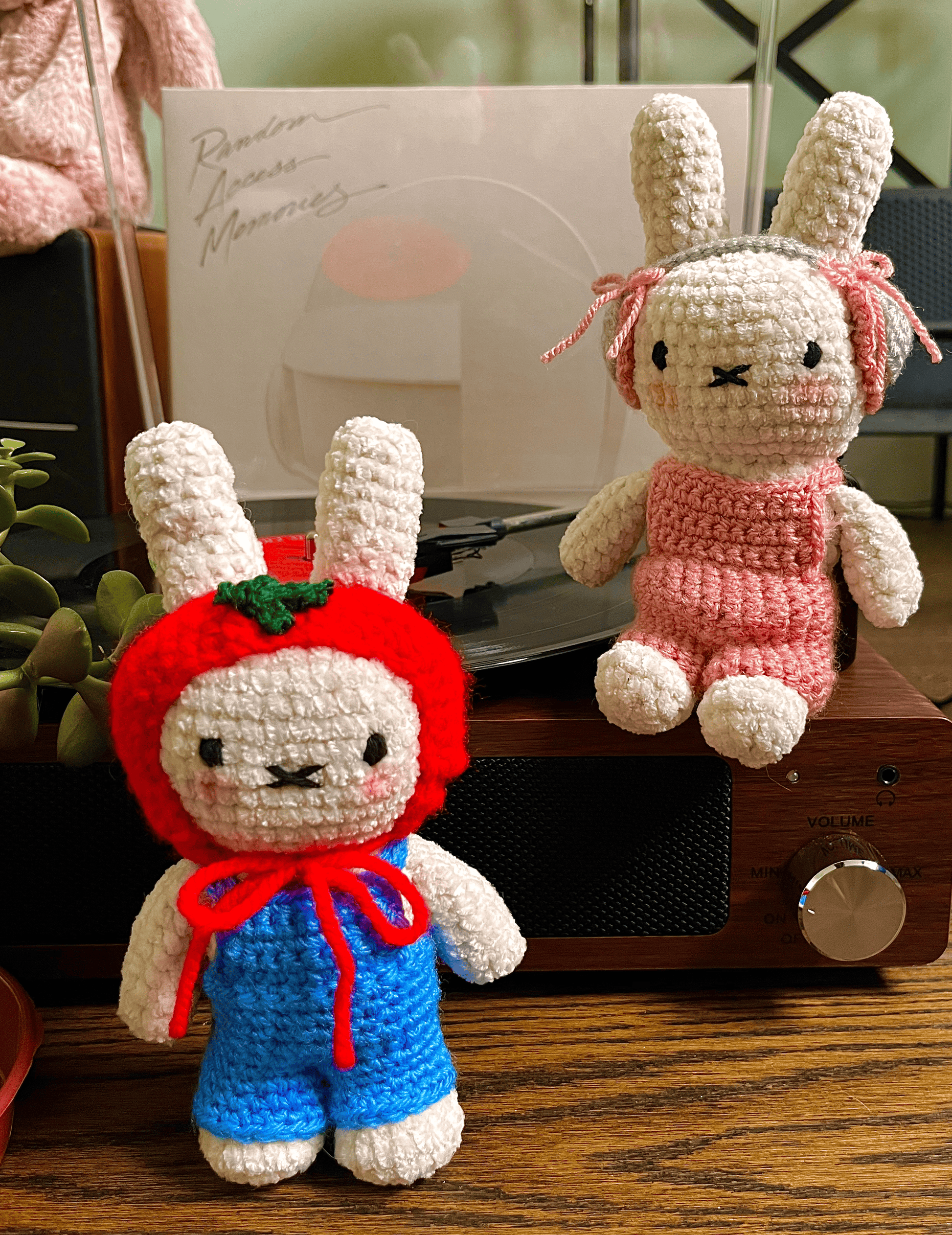 Two handmade Miffy crochet plush toys in blue and pink outfits, cute Miffy character collectibles and home decor