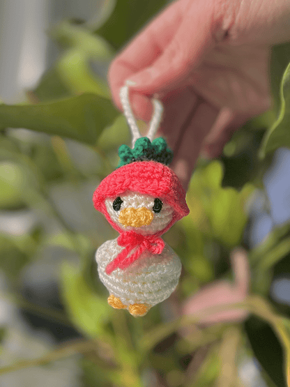 Mini duckling crochet keychain with flower hat, cute Easter accessory and handmade spring bag charm available in three sizes