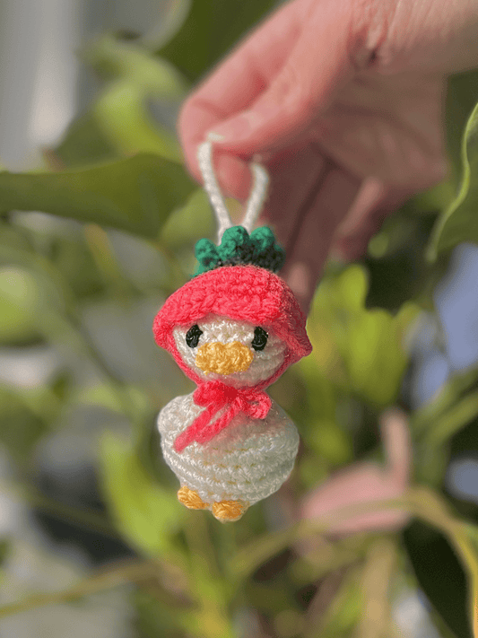 Mini duckling crochet keychain with flower hat, cute Easter accessory and handmade spring bag charm available in three sizes