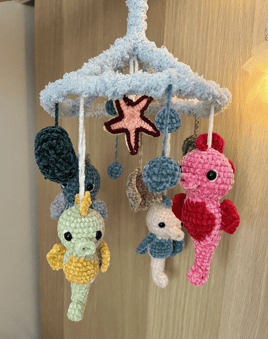 Handmade crochet Seahorse Ocean Mobile with four seahorses, seashells and fluffy light blue frame