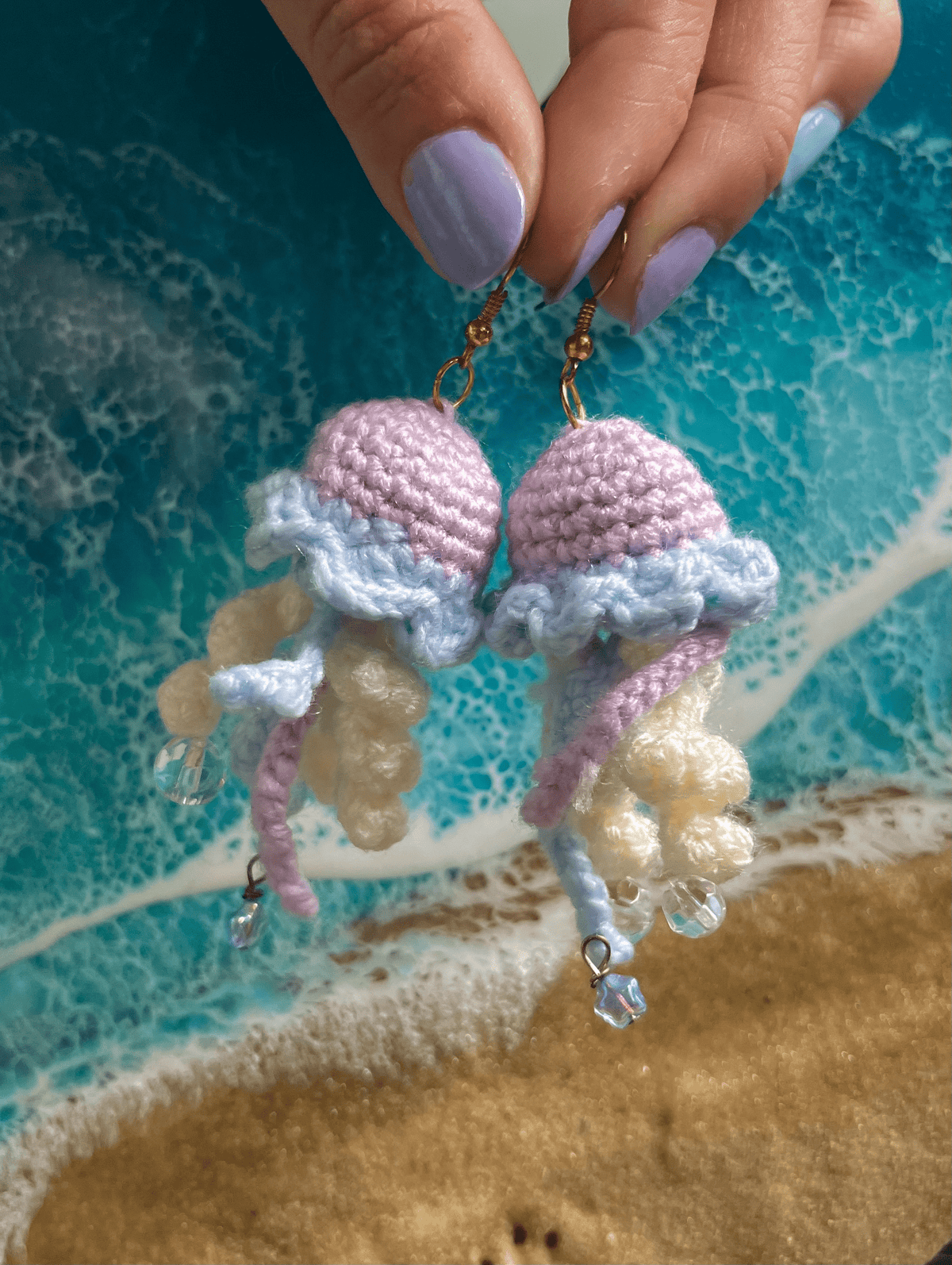 Limited edition handmade crochet jellyfish earrings with decorative embellishments in gold and silver ocean statement jewellery UK