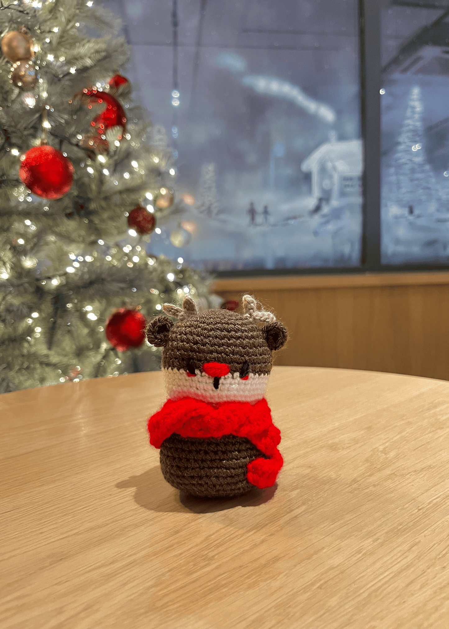 Handmade crochet Rudolph the Red-Nosed Reindeer Christmas decoration for festive mantel and shelf decor