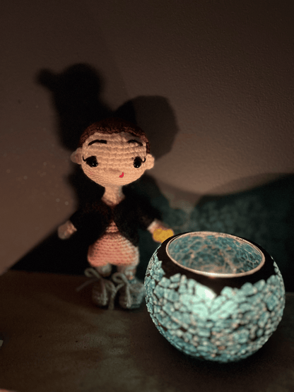 Crochet Eleven Stranger Things character figure displayed as part of a handmade Stranger Things fan collection