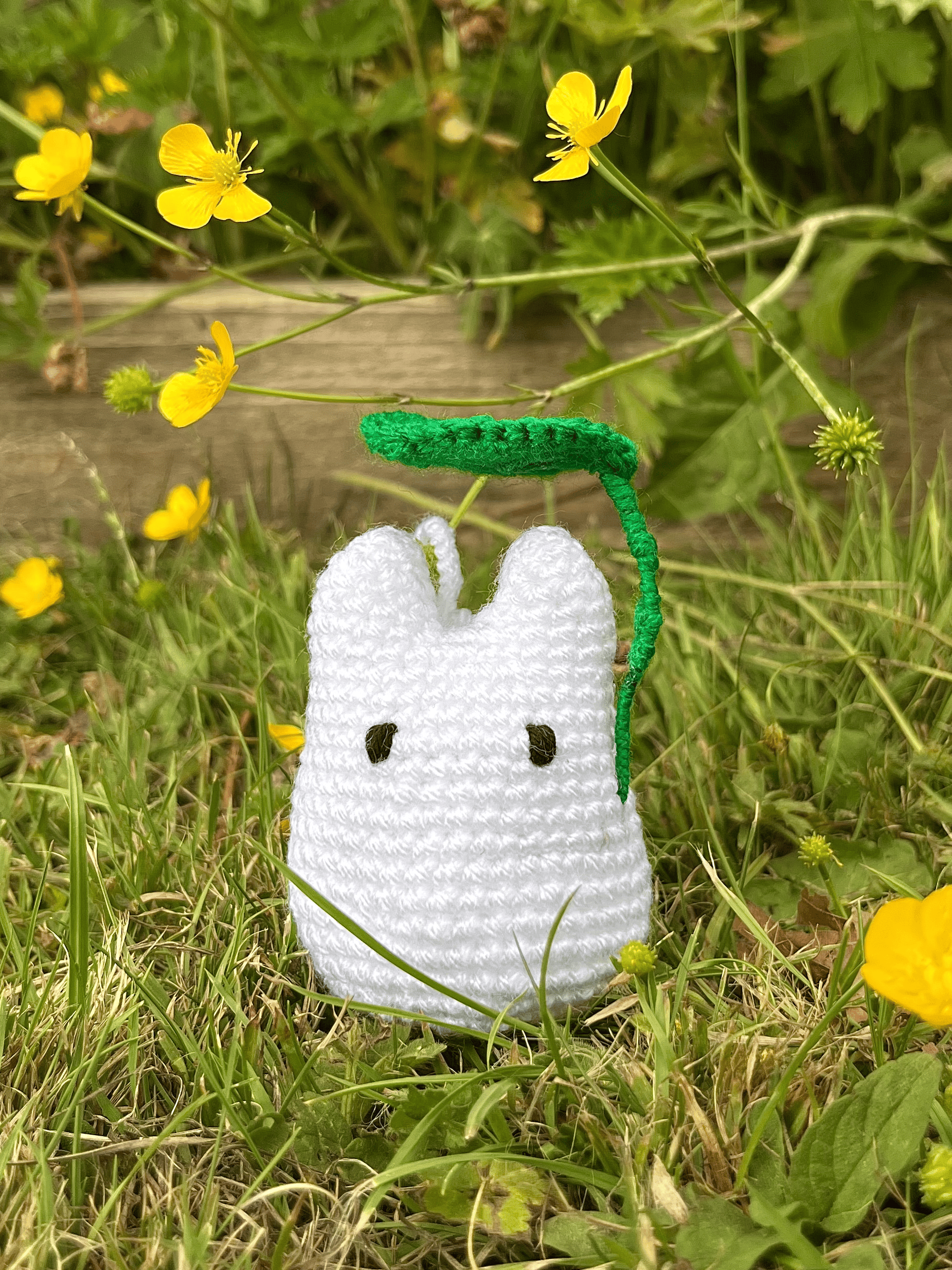 White Totoro crochet bag charm attached to a backpack, cute Studio Ghibli and My Neighbour Totoro accessory